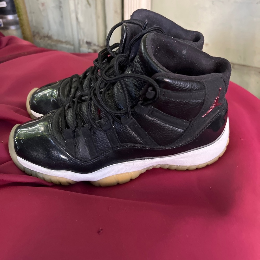Air Jordan 11 Retro High-Top Sneakers in Black with Gum Soles